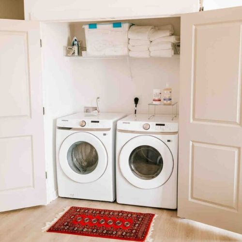Efficiency meets elegance: this washer dryer is tucked neatly into a drawer, saving space and adding a touch of modern convenience to our guests.