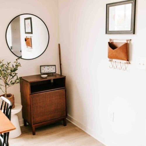 Convenience at your fingertips: this corner offers a handy spot to hang keys and a mirror for a quick check before you step out, ensuring you're always ready to seize the day.