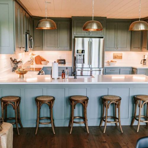 The state-of-the-art kitchen and dining area offer plenty of room to comfortably host family dinners and are outfitted with all the cookware, dishes, utensils, and appliances you will need to cook delicious meals. Bar top has seating for five.