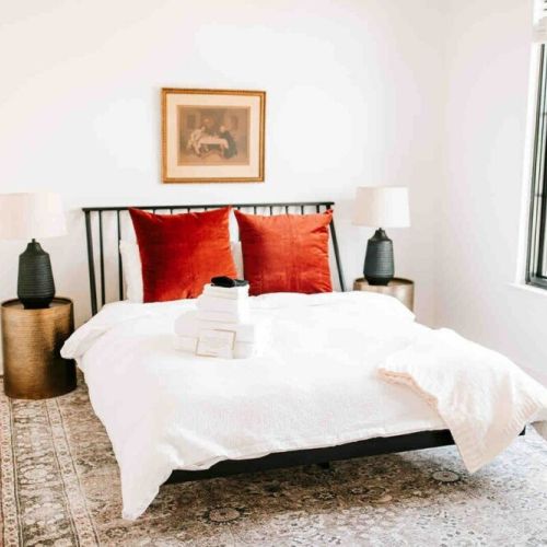 Relax in style: bedroom number two offers a spacious retreat with a comfortable queen-sized bed, promising a restful night's sleep in a cozy setting.