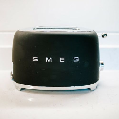 The state-of-the-art kitchen and dining area offer plenty of room to comfortably host family dinners and are outfitted with all the cookware, dishes, utensils, and appliances you will need to cook delicious meals including this SMEG toaster.