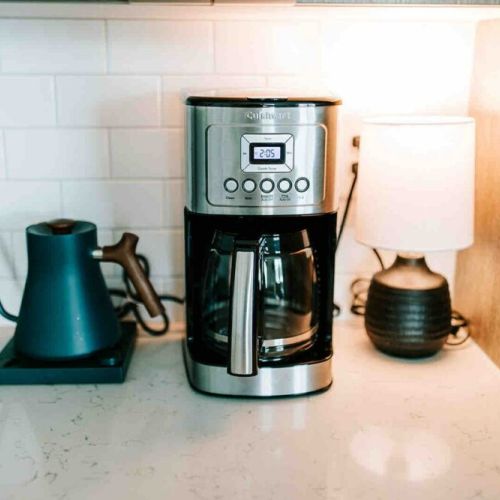Fuel your day: this kitchen is a coffee lover's dream, complete with a premium drip coffee maker, Fellow Kettle, and a local coffee at the ready!
