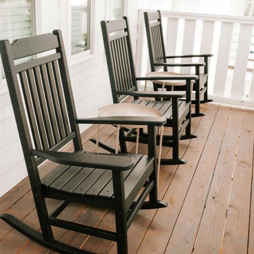 The upstairs porch features rocking chairs for you to enjoy peaceful time outside.