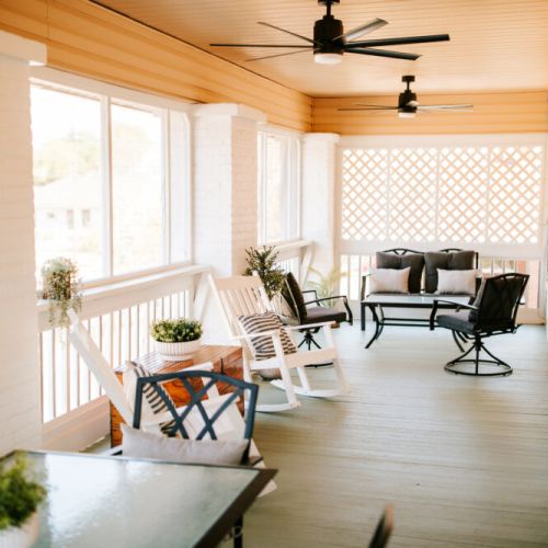 Screened in Porch with plenty of seating.