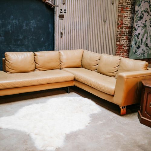 The large comfortable leather couch is perfect for enjoying a movie or chatting with friends.