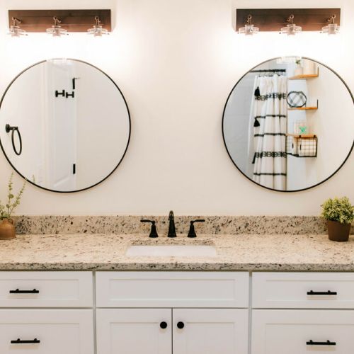 The bathroom creatively features double mirrors so no one is fighting over getting ready space!