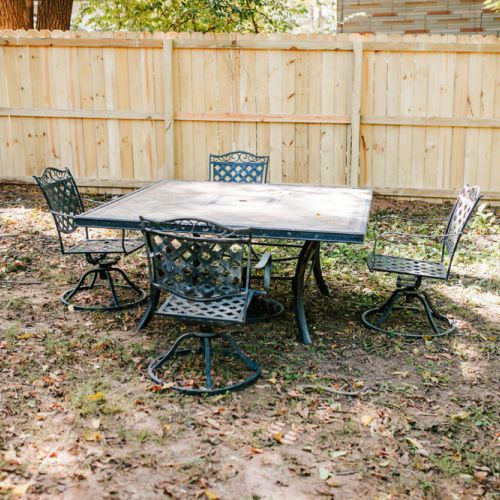 The outdoor dining area is setup for you to enjoy the spacious, private yard.