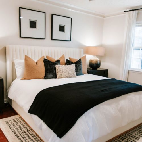 Dreamy king suite with luxe bedding, warm lighting, and modern comfort. Includes an ensuite bathroom.