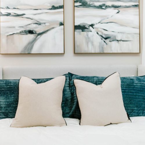 Calm, inviting, and artfully styled — soft pillows and serene artwork create a restful retreat designed for your ultimate comfort.