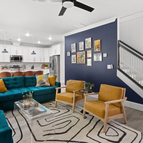 Relax in this vibrant designer living room where style meets comfort. From the statement wall to the plush velvet seating, every corner is Insta-worthy.