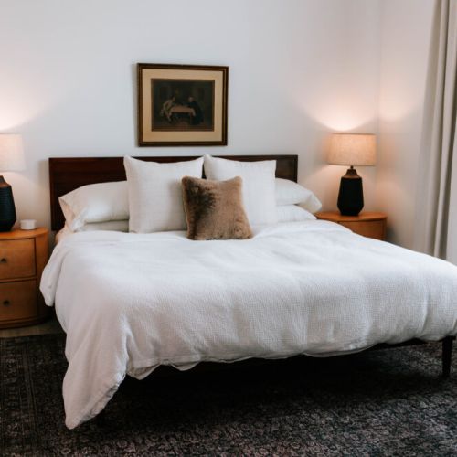 Dreamy mornings and cozy nights await. This serene bedroom offers the perfect blend of comfort and style — plush bedding, warm lighting, and plenty of natural light to start your day right.