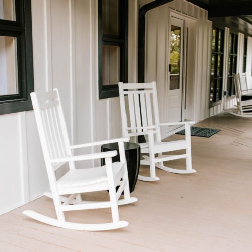 Unwind in style on the front porch with classic white rocking chairs—the perfect spot for morning coffee, evening wine, or simply soaking in the serene surroundings.