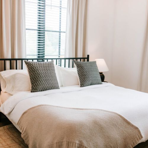 Wake up surrounded by natural light and peaceful design. Our cozy king bed with luxe linens is ready to welcome you.