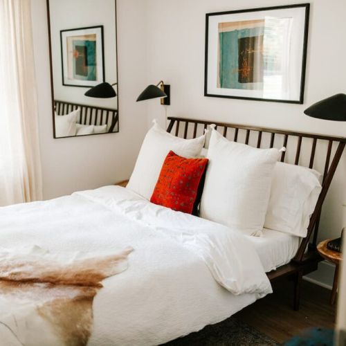 Cozy comfort awaits: this second-level bedroom features a queen bed, inviting you to unwind and relax in style.