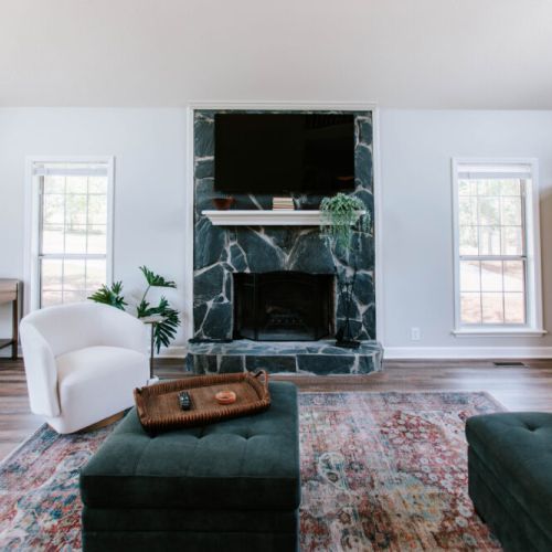 Gather, unwind, and stay awhile. This inviting living room is made for movie nights, and fireside chats.