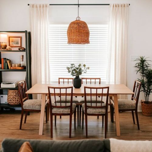 Gather and dine in style: this dining area features a table for six, with three additional seats at the kitchen island, providing ample space for enjoying meals and making memories with family and friends.