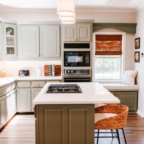 Whether you're whipping up a home-cooked meal or sipping your morning coffee at the island, this kitchen is fully stocked and ready for you. Bonus: that cozy window seat is perfect for lounging with a cookbook or catching the morning sun.