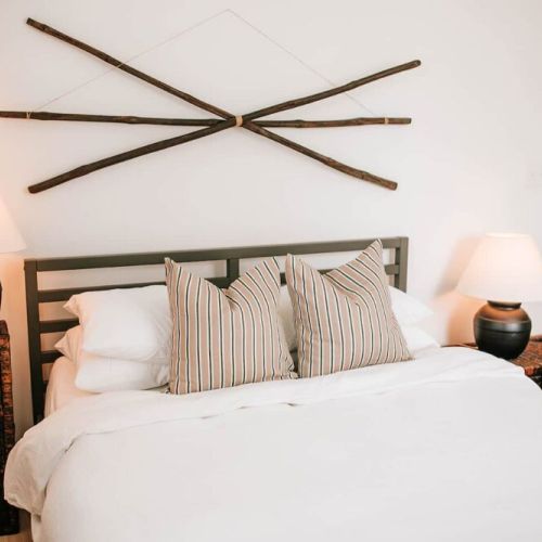In every bedroom, you'll find a queen-sized Purple Mattress accompanied by organic Supima cotton linens and a duvet. Rest assured that each element of bedding, including throw pillows and blankets, undergoes meticulous sanitization between every gues
