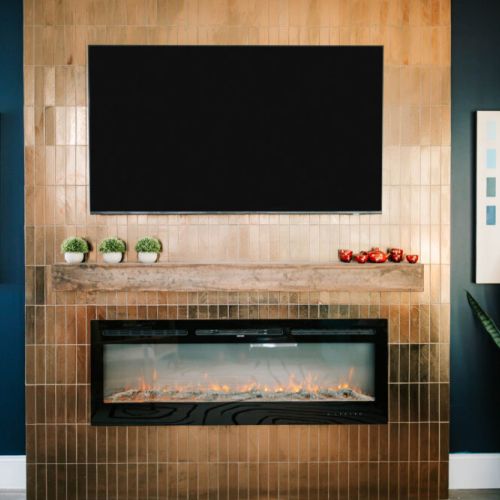 Catch your favorite show or sip wine by the sleek electric fire, framed by glam gold tile and bold pops of color. The vibe? Pure IG gold