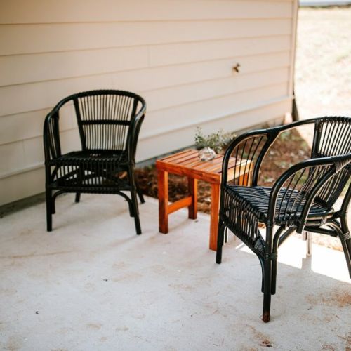 Outdoor oasis: the back porch offers a relaxing retreat, perfect for enjoying the fresh air and peaceful surroundings.