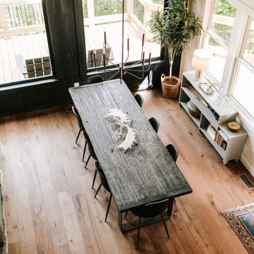 The hand-crafted dining table can seat up to eight, and there are also five seats available at the extended kitchen bar.