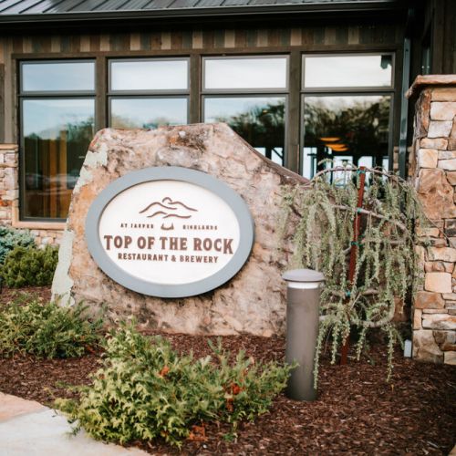 Nestled amidst the breathtaking vistas of Jasper Highlands, Top of the Rock restaurant offers a culinary experience that seamlessly blends gourmet dining with panoramic views, just a short walk away from the cabin