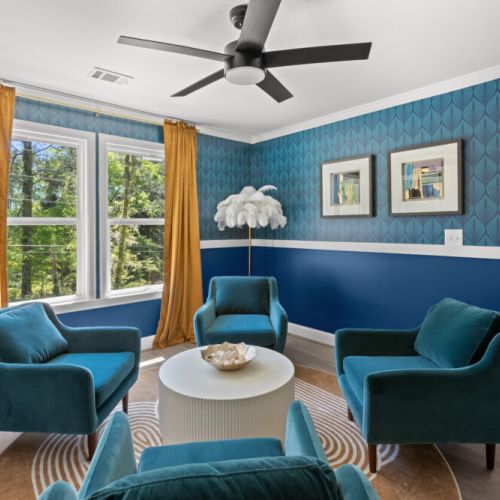 This stylish sunlit lounge blends glam decor with cozy vibes—perfect for morning coffee, game night, or an impromptu photoshoot!