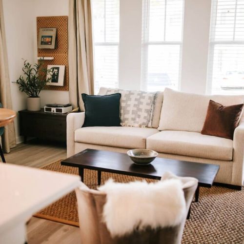 Find your peace in our beautifully designed living room, where calming ambiance meets comfort. Relax with your favorite shows on the large-screen TV or enjoy the nostalgic tunes of vinyl on our record player!