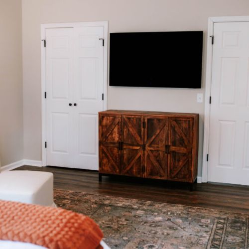 Wind down your way, stream your favorites or enjoy a quiet night in this serene bedroom retreat with rustic touches and modern comforts.