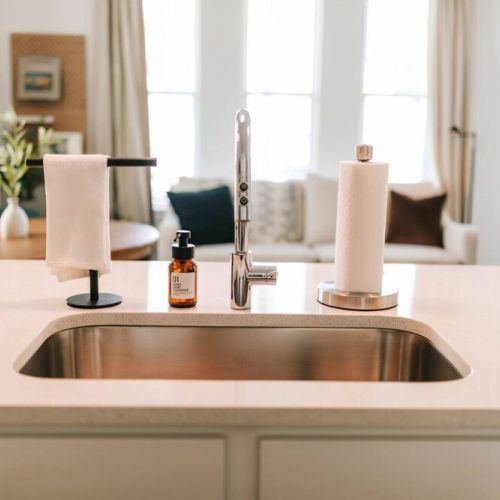 Our kitchen features a stainless steel sink with garbage disposal to make dishes and clean up a breeze!