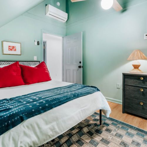 Settle into a restful retreat with crisp linens, bold pops of color, bedside lighting, and in-room A/C to keep you comfortable. After a day of exploring, unwind beneath the ceiling fan and enjoy a peaceful space designed for a great night’s sleep.