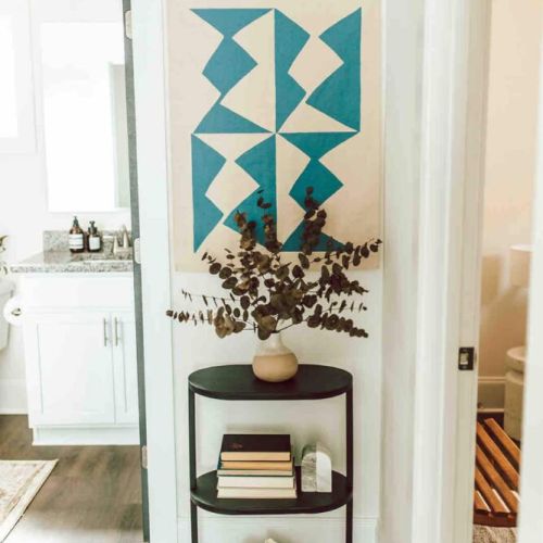Gallery in the making: the upstairs hallway is a showcase of creativity, with art pieces adorning the walls, adding charm and character to this artsy space.