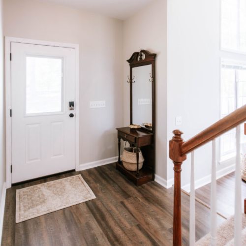 Step inside and feel at home. This bright, welcoming entryway leads you straight to the heart of the house or up to cozy corners above.
