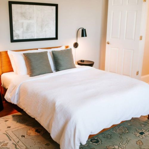 Every bedroom offers a comfortable queen-sized bed equipped with a Purple mattress and organic cotton sheets.