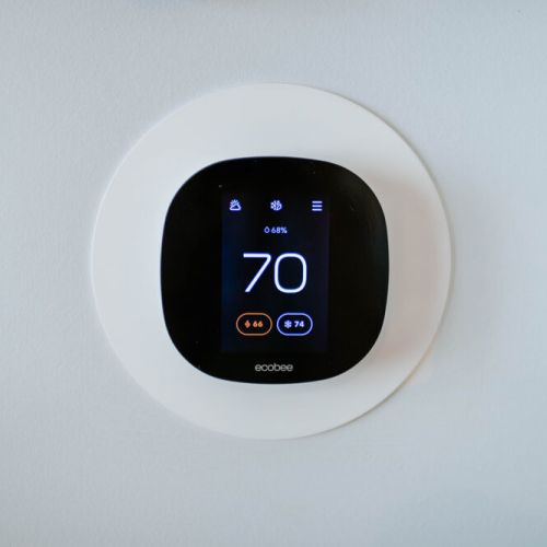 Effortlessly control the cabin's temperature with this Ecobee thermostat controller.