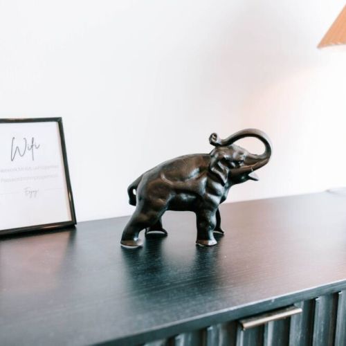 Details that make you feel at home. Our cozy space is filled with thoughtful touches — like this charming elephant and easy access to WiFi — making your stay stylish, connected, and unforgettable.