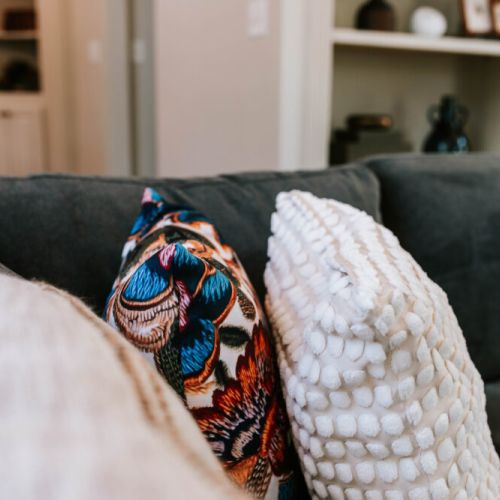 Soft textures and bold patterns come together to create the perfect cozy corner. These plush pillows add a pop of personality and comfort to your living room lounging.