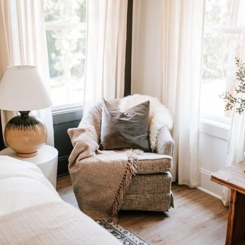 Relax in style: the sitting area in the master bedroom offers a cozy retreat, perfect for unwinding with a book or enjoying a moment of peace and quiet.