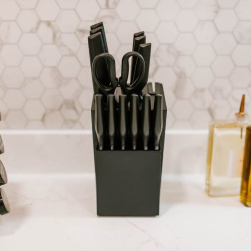 Minimal, well-organized countertop enhance the kitchen’s polished look.