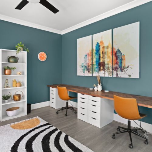 This vibrant lounge-workspace hybrid is bursting with color, style, and cozy vibes—perfect for remote work or a good book in hand.