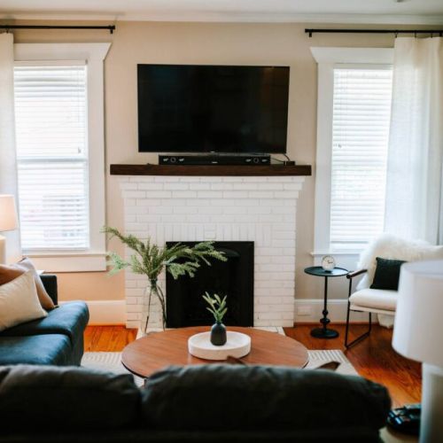 In the living room, you can stream your favorite shows on the flat-screen Smart TV as you relax on the comfy sofa.