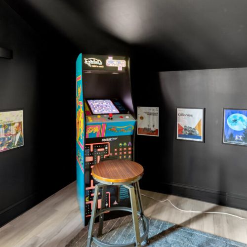 Retro arcade vibes meet cozy movie nostalgia—perfect for gamers and film buffs alike!