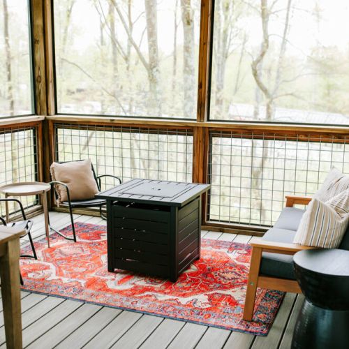 Relax outdoors in style! Our cabin features a cozy outdoor lounge area, perfect for enjoying the fresh mountain air.