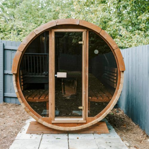 Cozy outdoor barrel sauna, perfect for unwinding and relaxing.