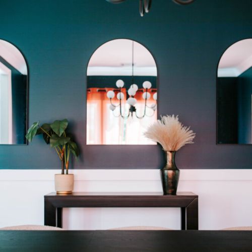 Modern arches, moody hues, and curated decor—this space is all about bold elegance and photo-worthy vibes.