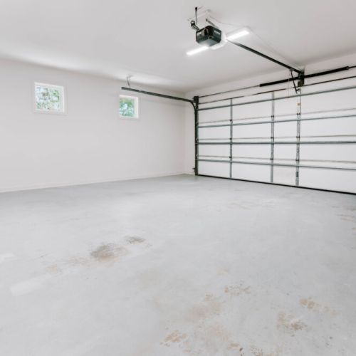Spacious car garage with plenty of room for parking and storage.