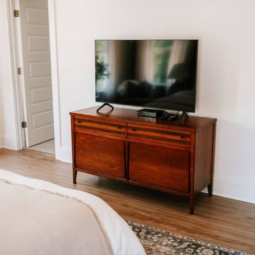 Your sanctuary awaits: the master bedroom on the second level offers a luxurious retreat, promising comfort and relaxation in a serene setting.