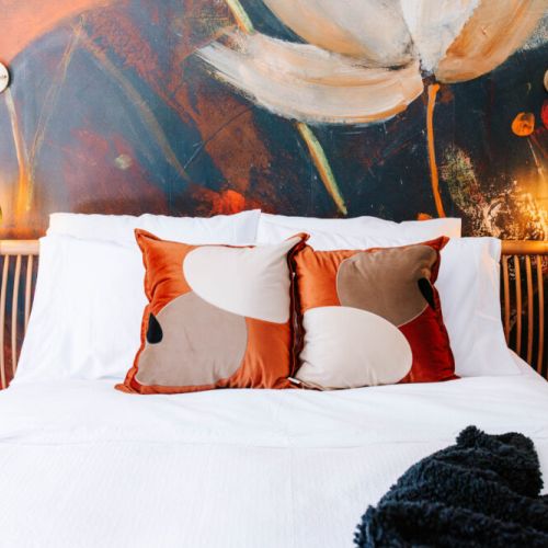Drift into a dreamy night’s sleep surrounded by floral flair, plush textures, and cozy lighting—style and comfort in perfect harmony.