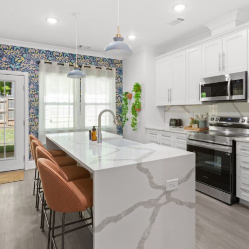 This chef’s kitchen blends modern elegance with playful charm—perfect for cooking, sipping, or simply admiring the vibrant vibes.