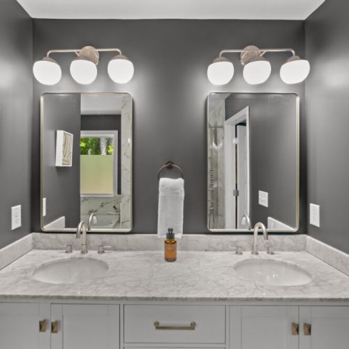 This elegant dual-sink vanity is perfect for couples or travel buddies—get ready in luxury without bumping elbows!